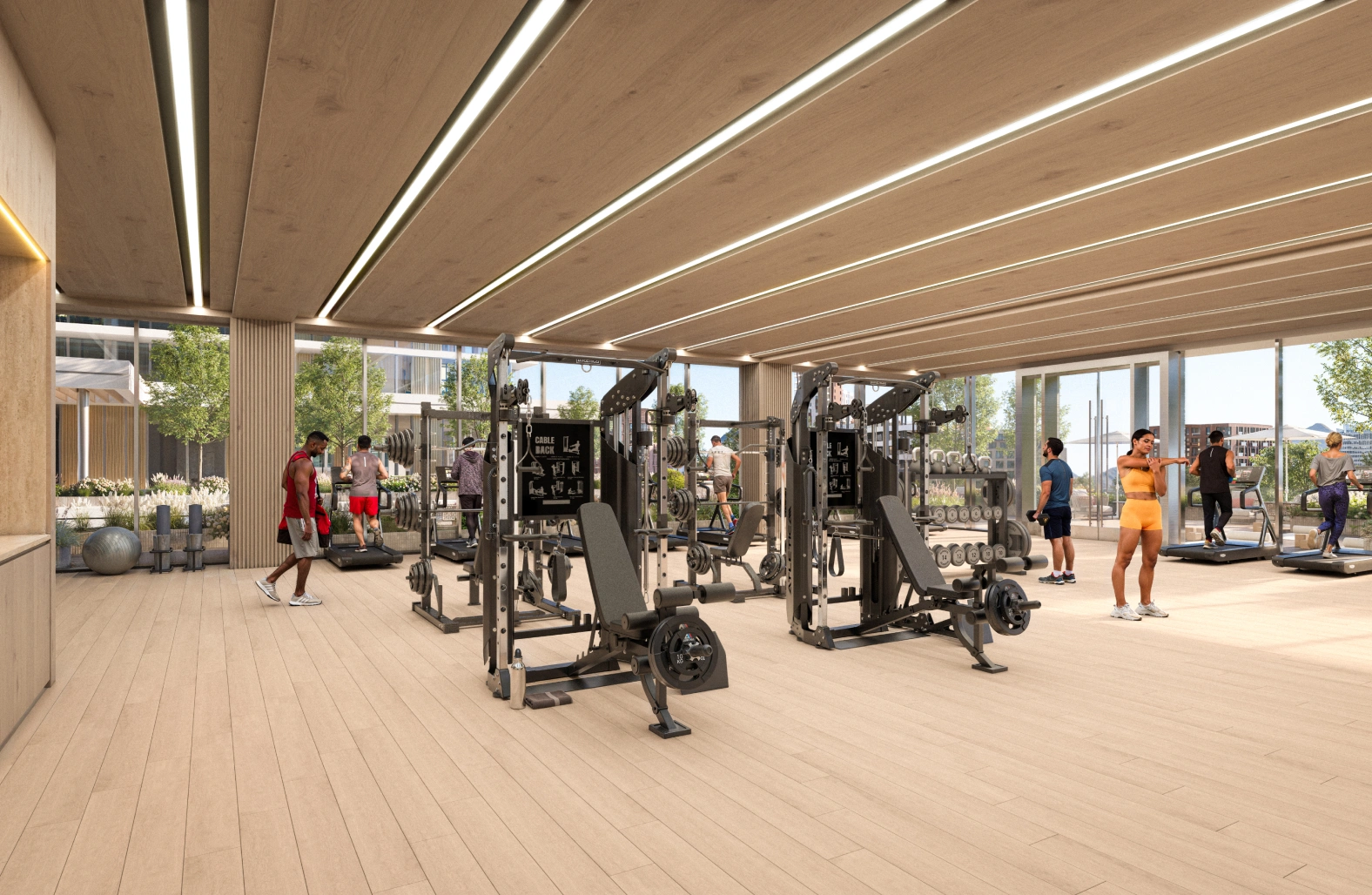 Corporate fitness center featuring strength training machines and floor to ceiling windows