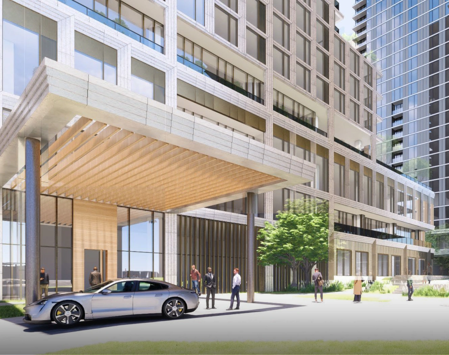 Upscale urban hotel exterior featuring glass lobby and contemporary architectural facade